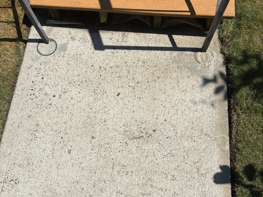 The same concrete pad after pressure washing