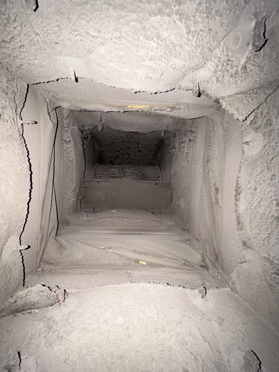 Looking down a rectangular trunk line coated in dust