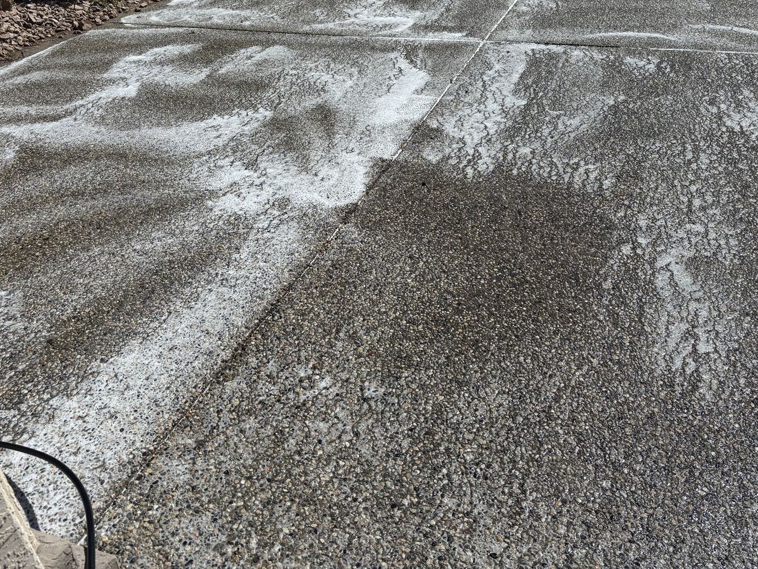 Cleaning solution being applied to a driveway during a Summitt job